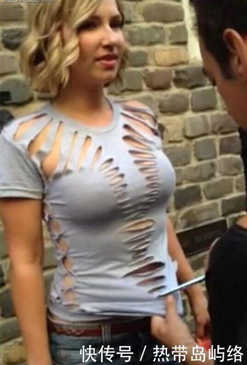 国外男子当街剪开美女衣服,路人停足观看默不作声