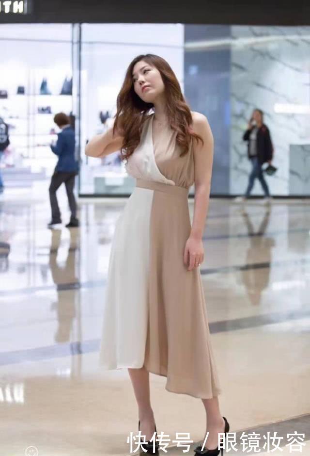美女穿着连衣裙清爽利落,展现婀娜多姿的风采 澳门赌博注册